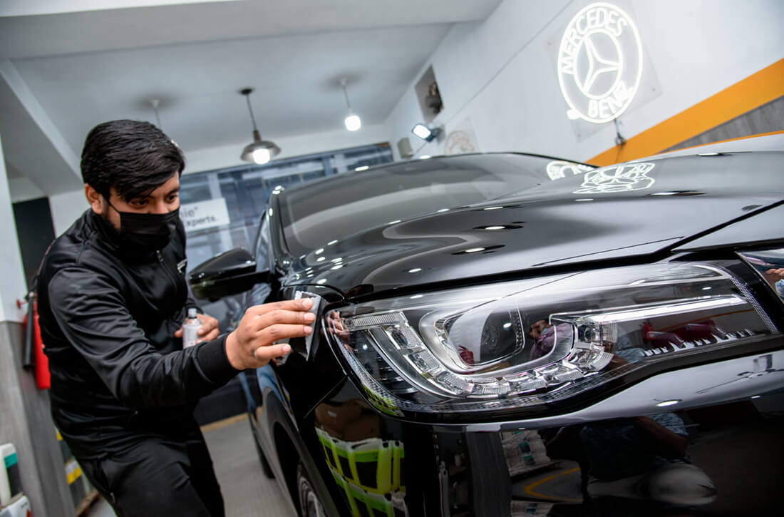 ceramic coating application in process by an expert KOCH CHEMIE certified detailer at demnok lahore